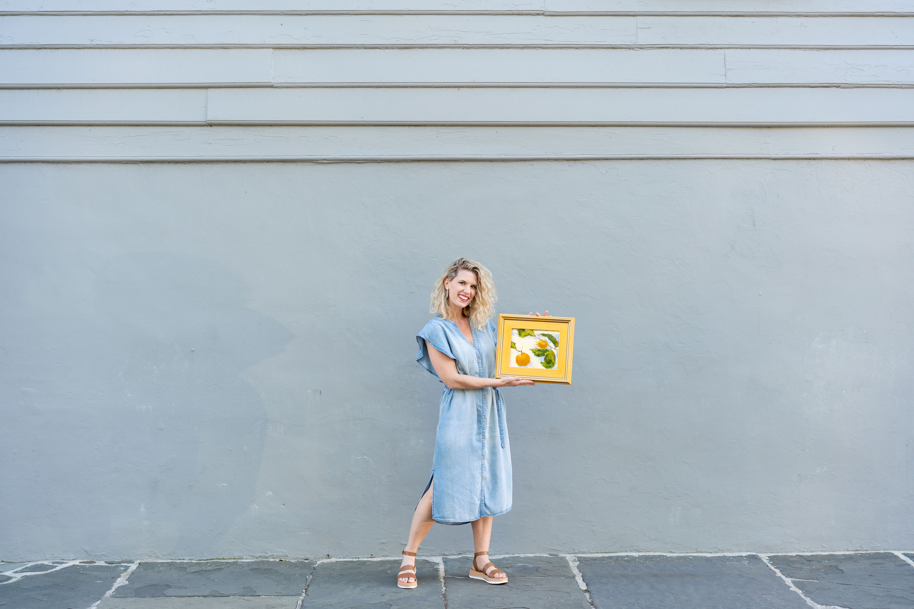 Painter Fallon Peper with a still life painting in Charleston, SC