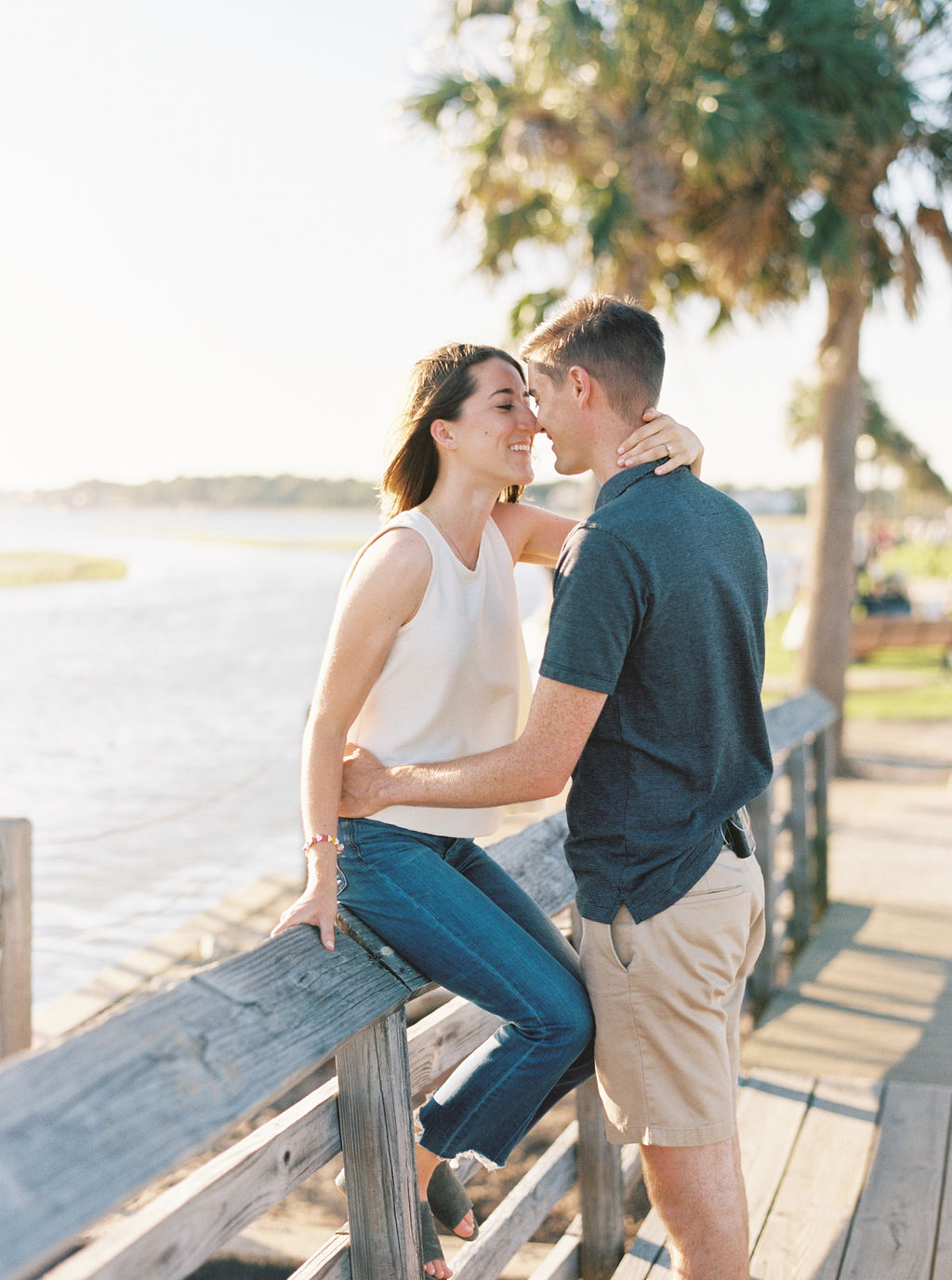 Engagement photos of Charleston photographer Abby Murphy and her fiance Hunter on Pitt Street Bridge in Mount Pleasant, South Carolina