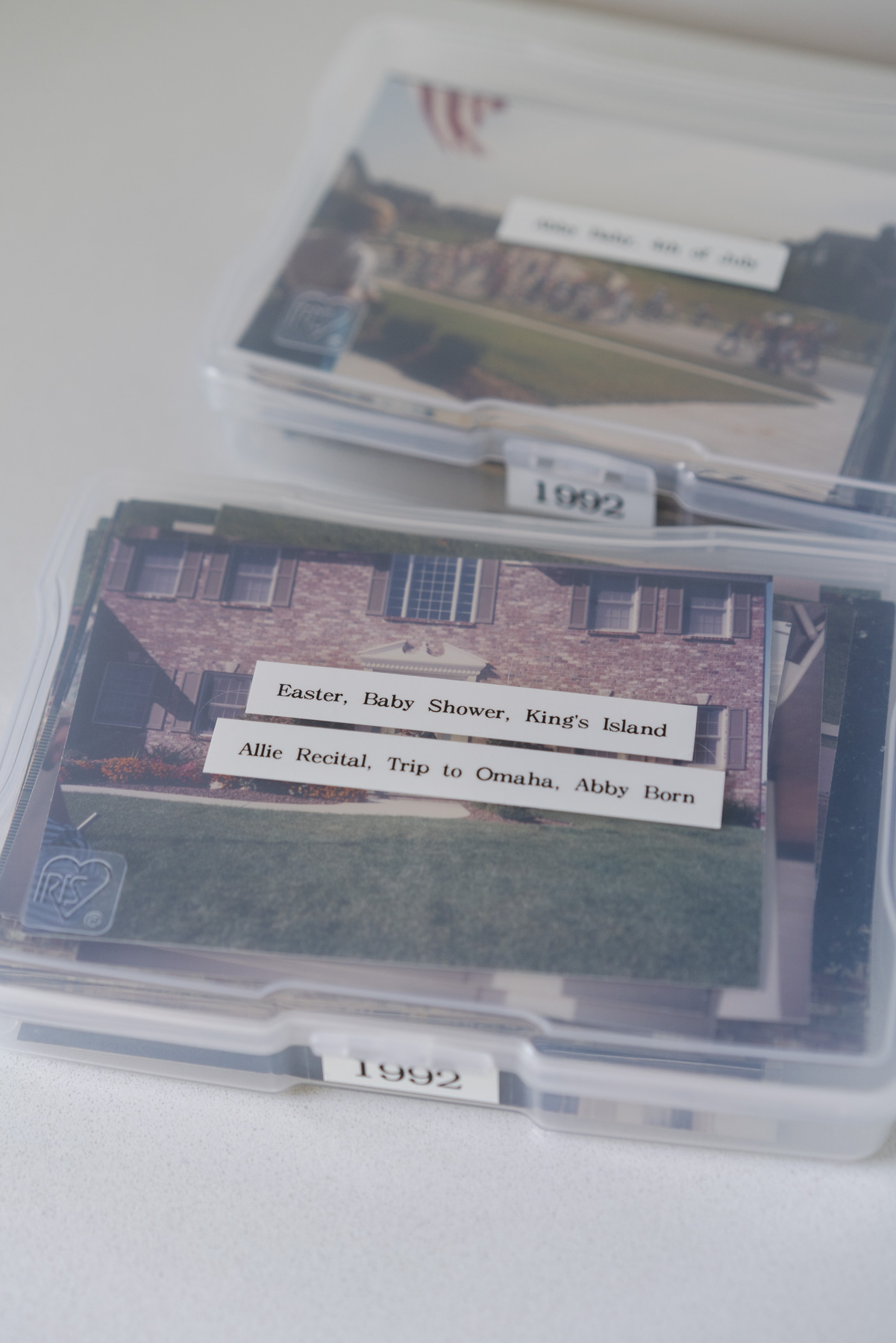 Close up of one of the labels on an Iris photo box compartment. It says, "Easter, Baby Shower, King's Island, Allie Recital, Trip to Omaha, Abby Born."

