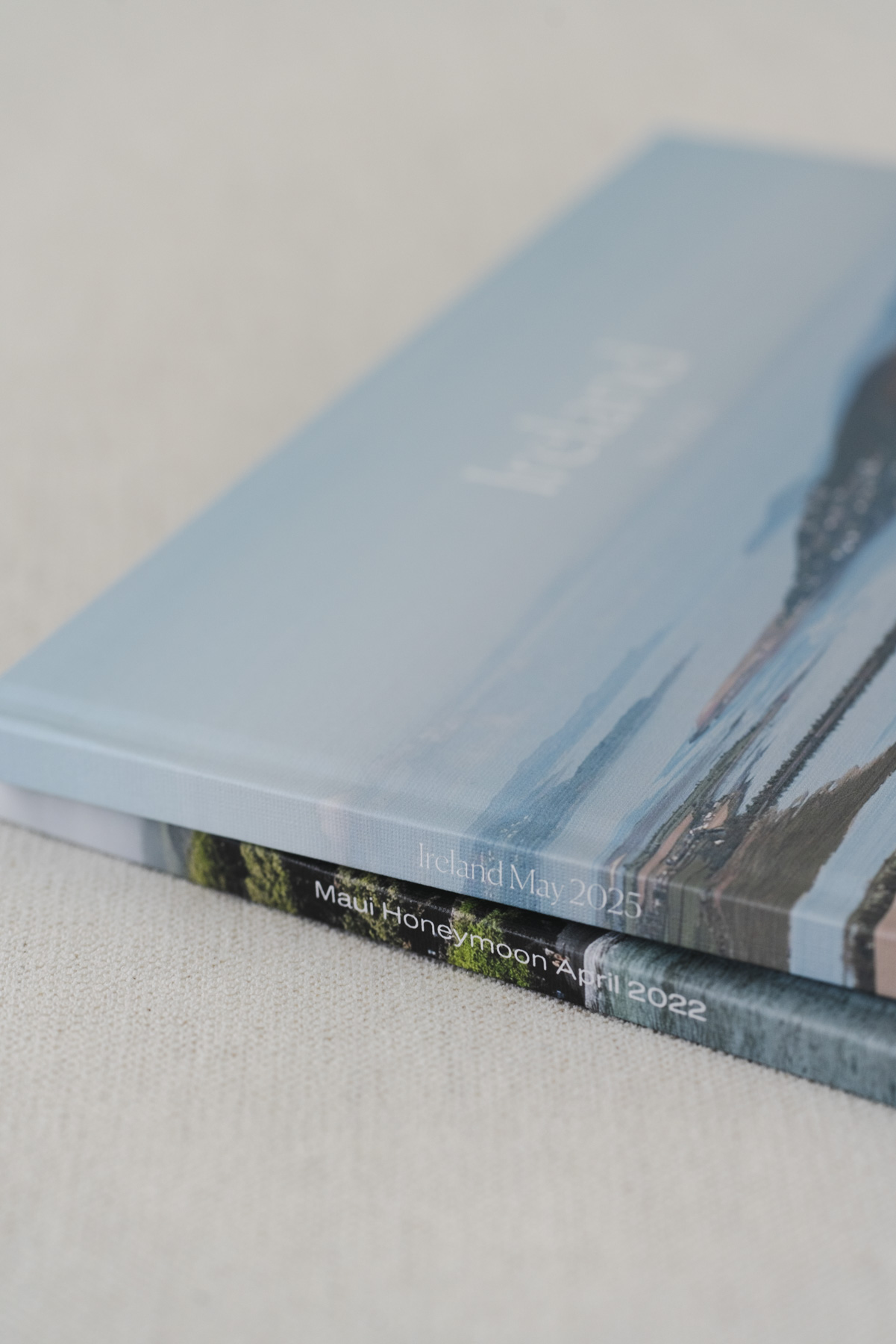 Close up view of the spines of the Ireland and Maui photo books. 