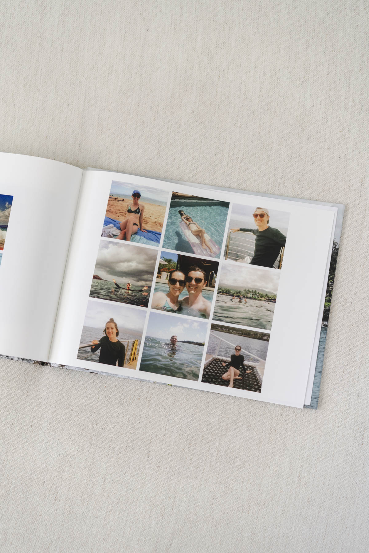Inside page of one of the photo books. Features 9 square photos of Abby and Hunter on a trip. 