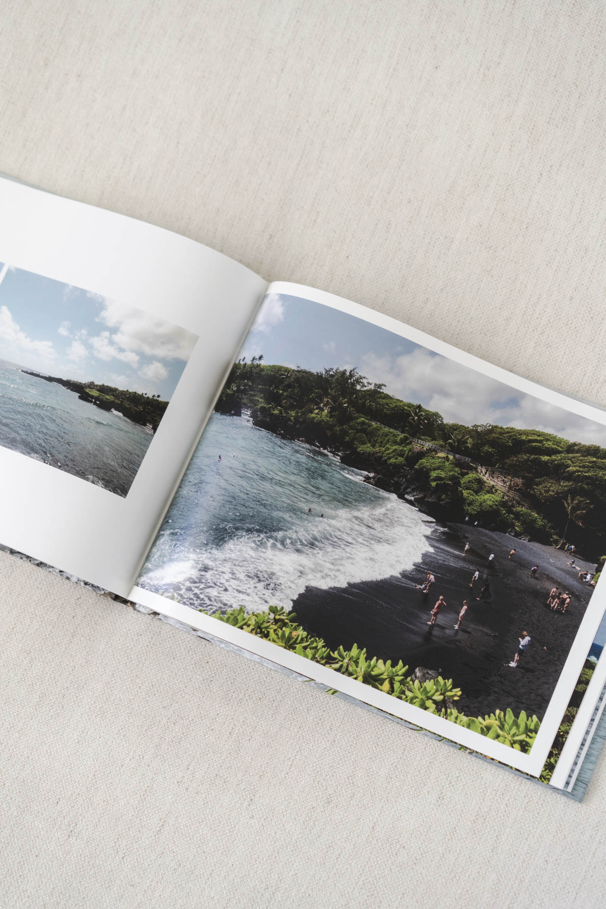 Close up photo of a large photo of a Hawaiian beach inside one of the photo books. 