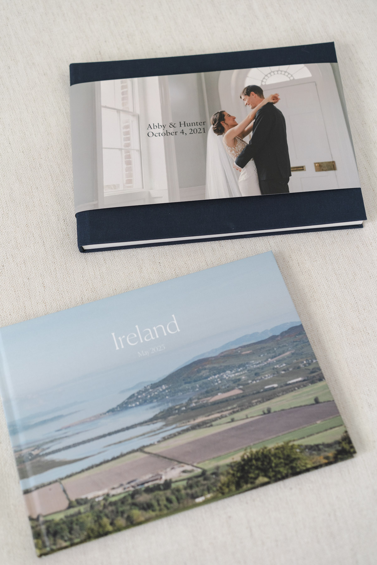 Close up photo of two photo books: Ireland, May 2023, and Abby and Hunter's wedding album. 