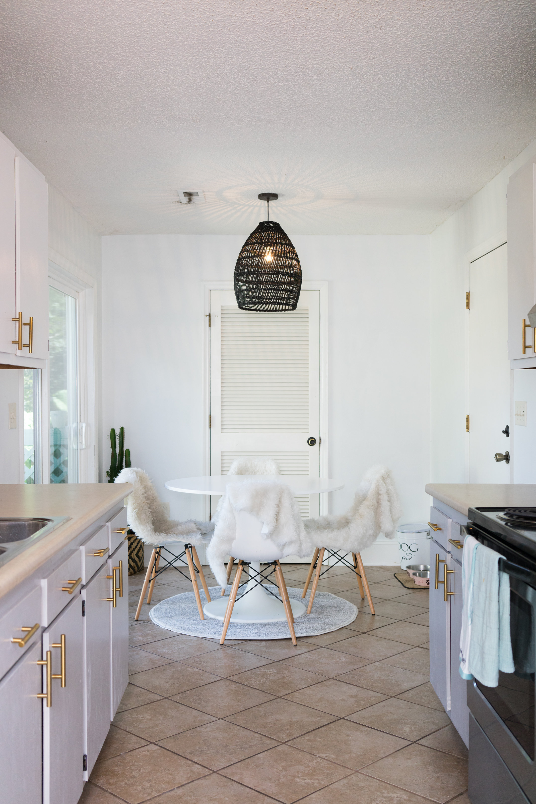 House Tour: A modern midcentury kitchen looking into a small dining area