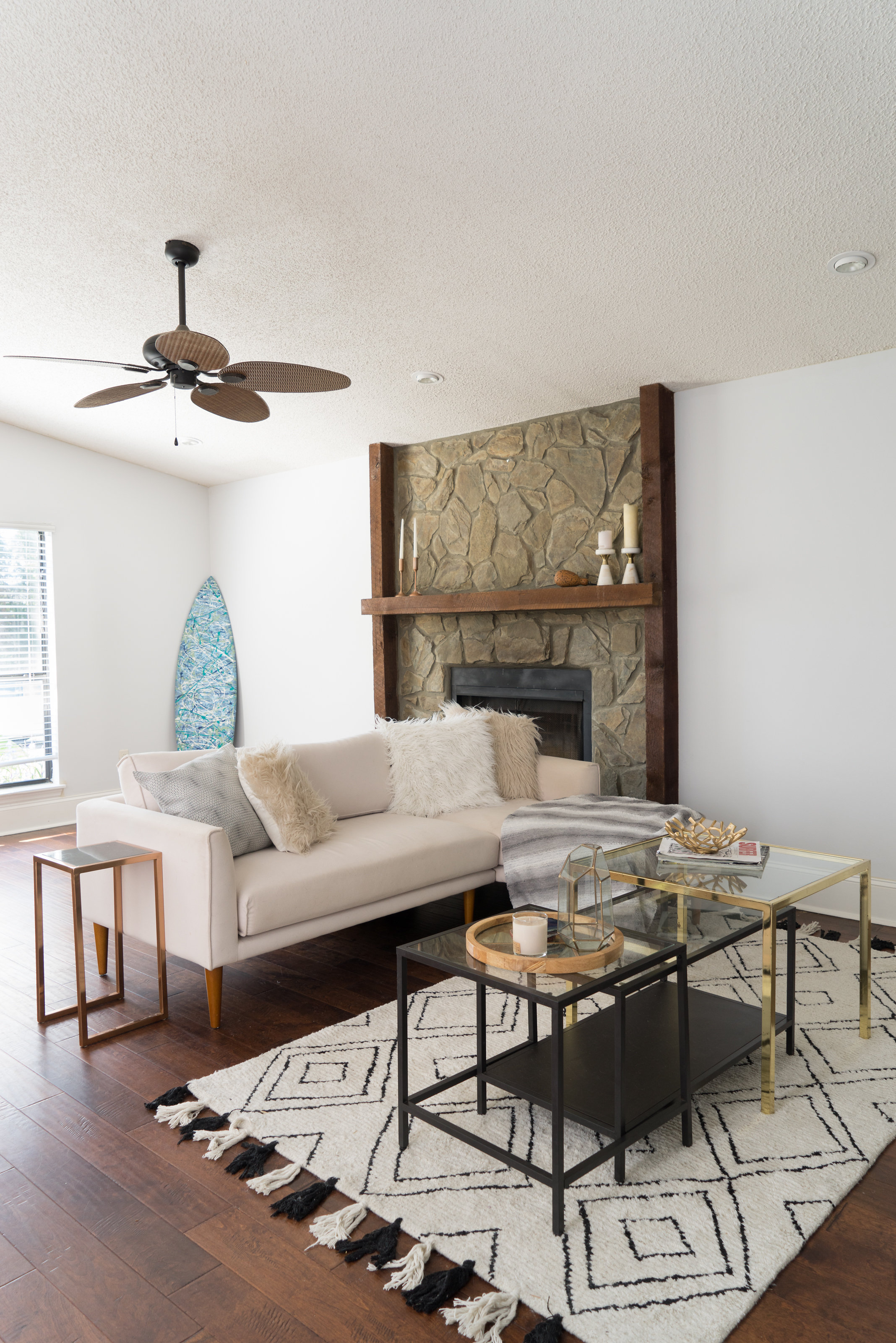 House Tour: Modern, mid-century living room with a couch, coffee table, and geometric rug