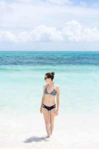 Girl standing in the water at a Turks and Caicos beach