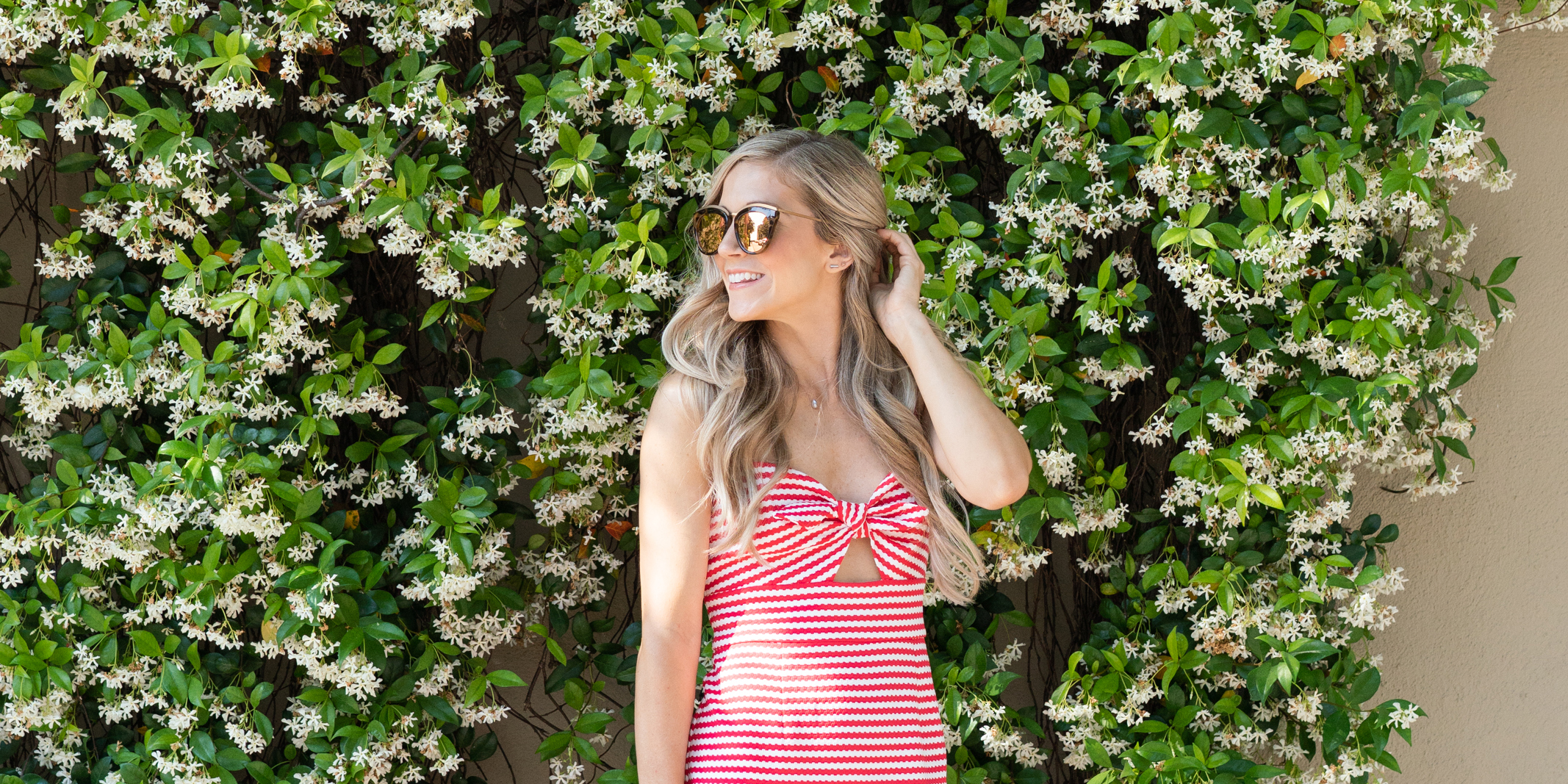 Charleston fashion blogger wearing a red striped dress and sunglasses