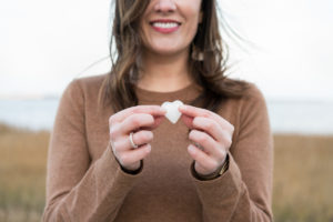 Woman holding a crystal shaped like a heart