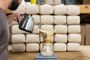 Man making a pour over coffee with King Bean Coffee Roasters