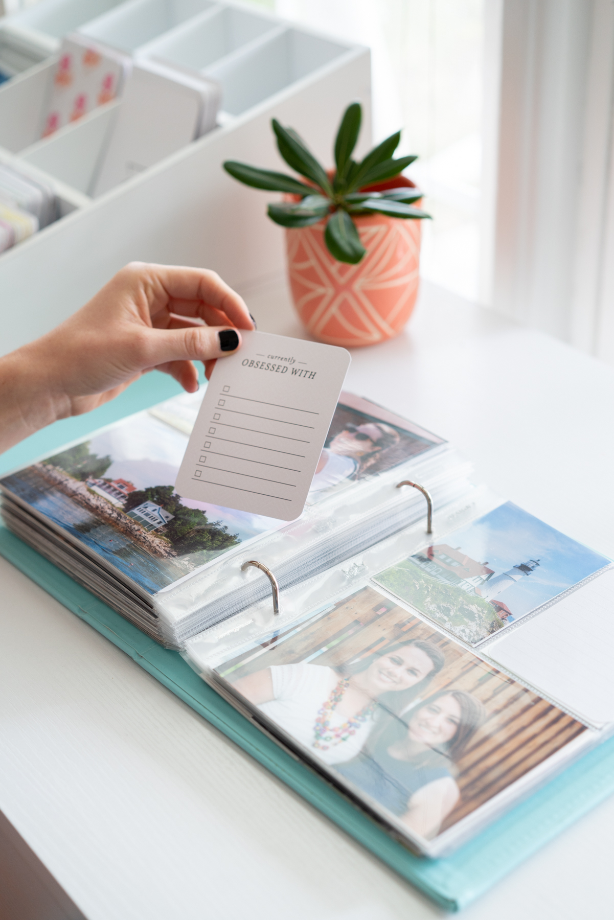 Girl holding a Project Life Core Kit scrapbooking card