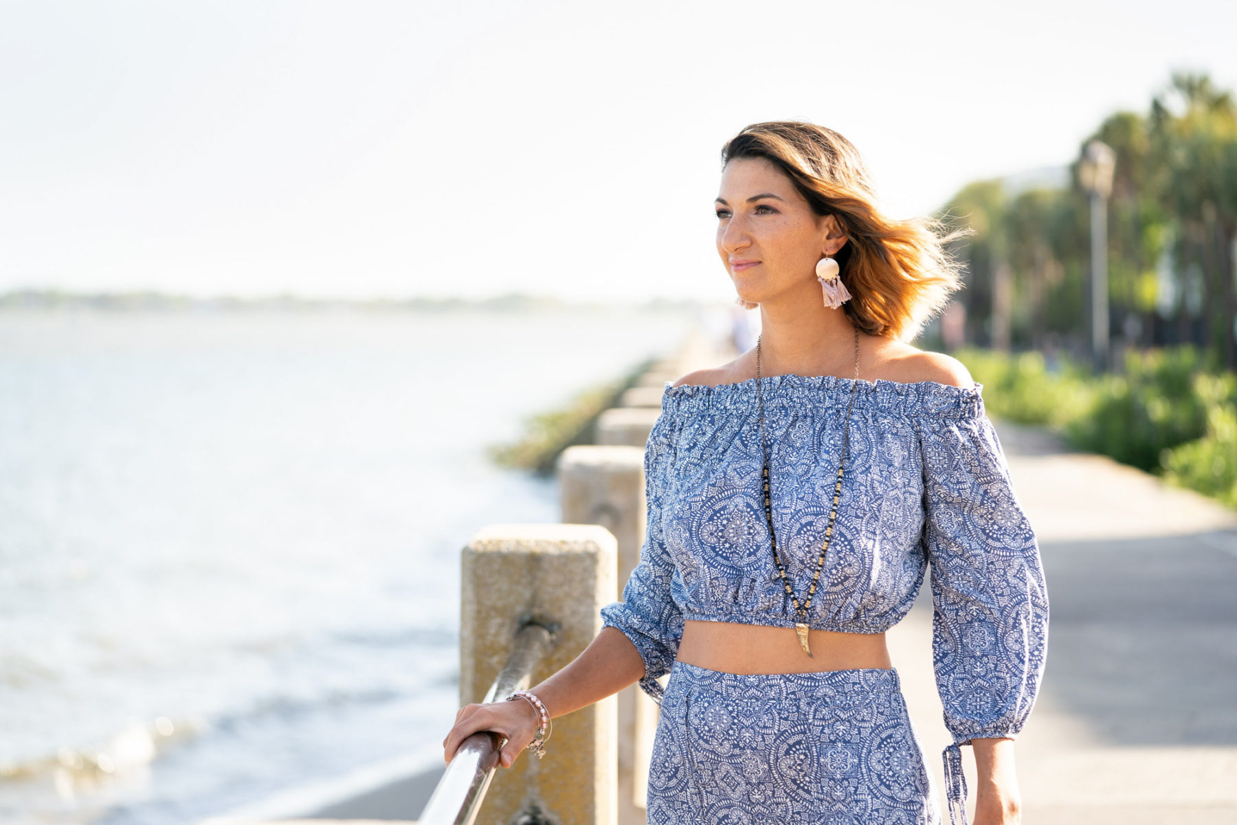 Woman looking out over the water on the Battery in Charleston, SC