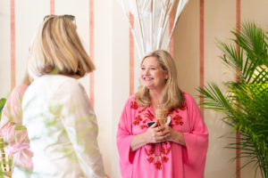 Amanda Lindroth talking with a guest at her Charleston store opening party