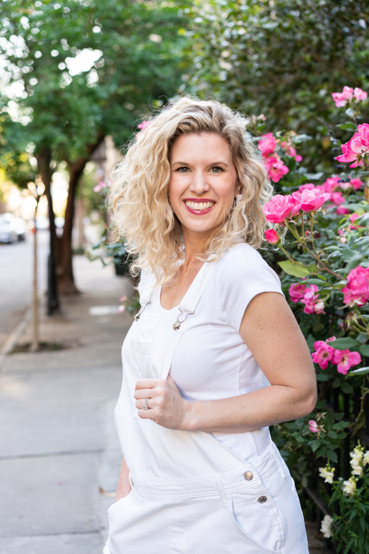 Portrait of a woman in white denim overalls