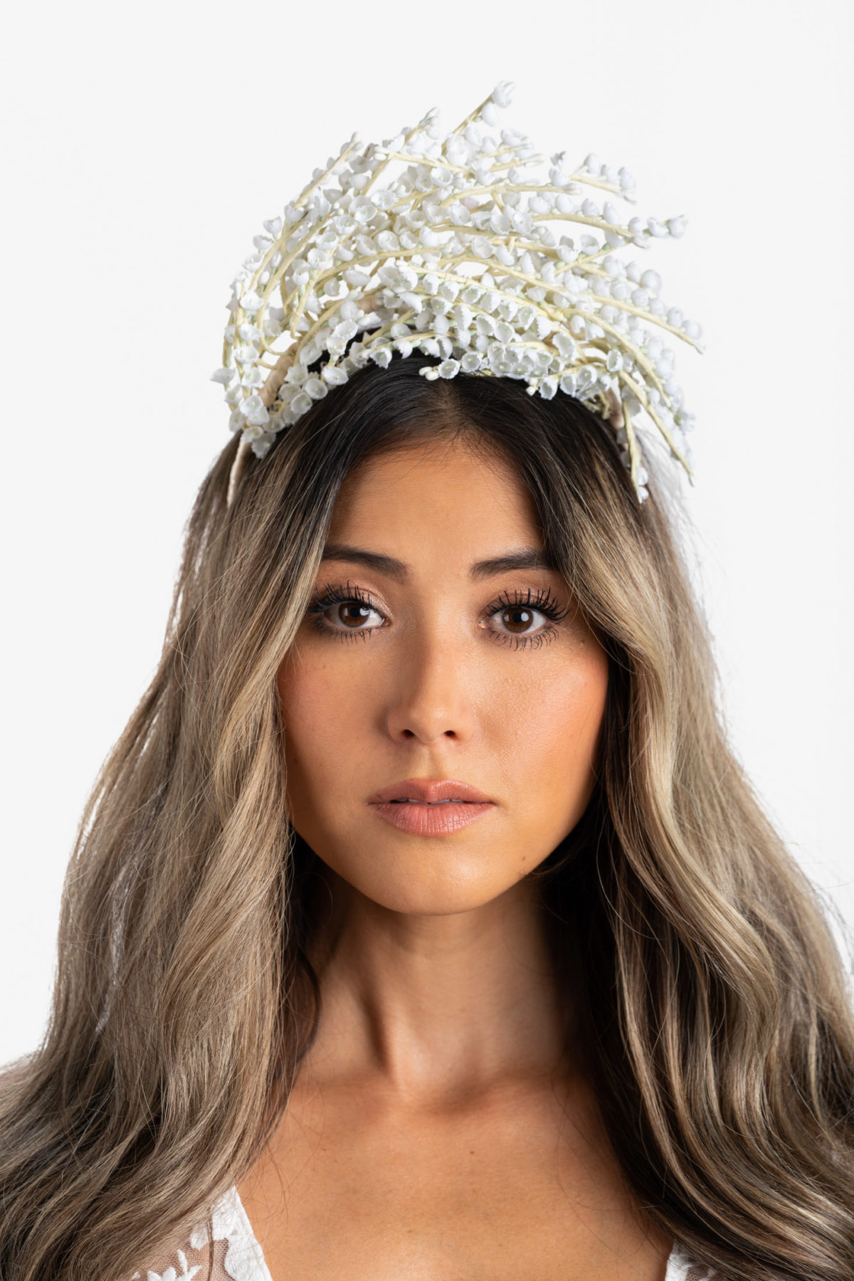Fashion studio photograph of a custom wedding headpiece by Mariee Lace Veils