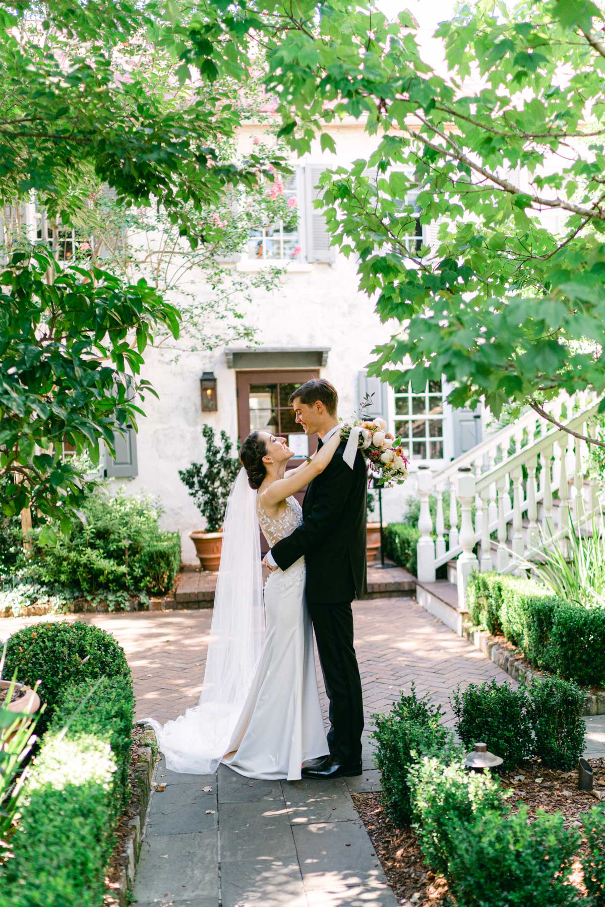 A bride and groom holding each other after getting married at Zero George hotel in Charleston, SC 