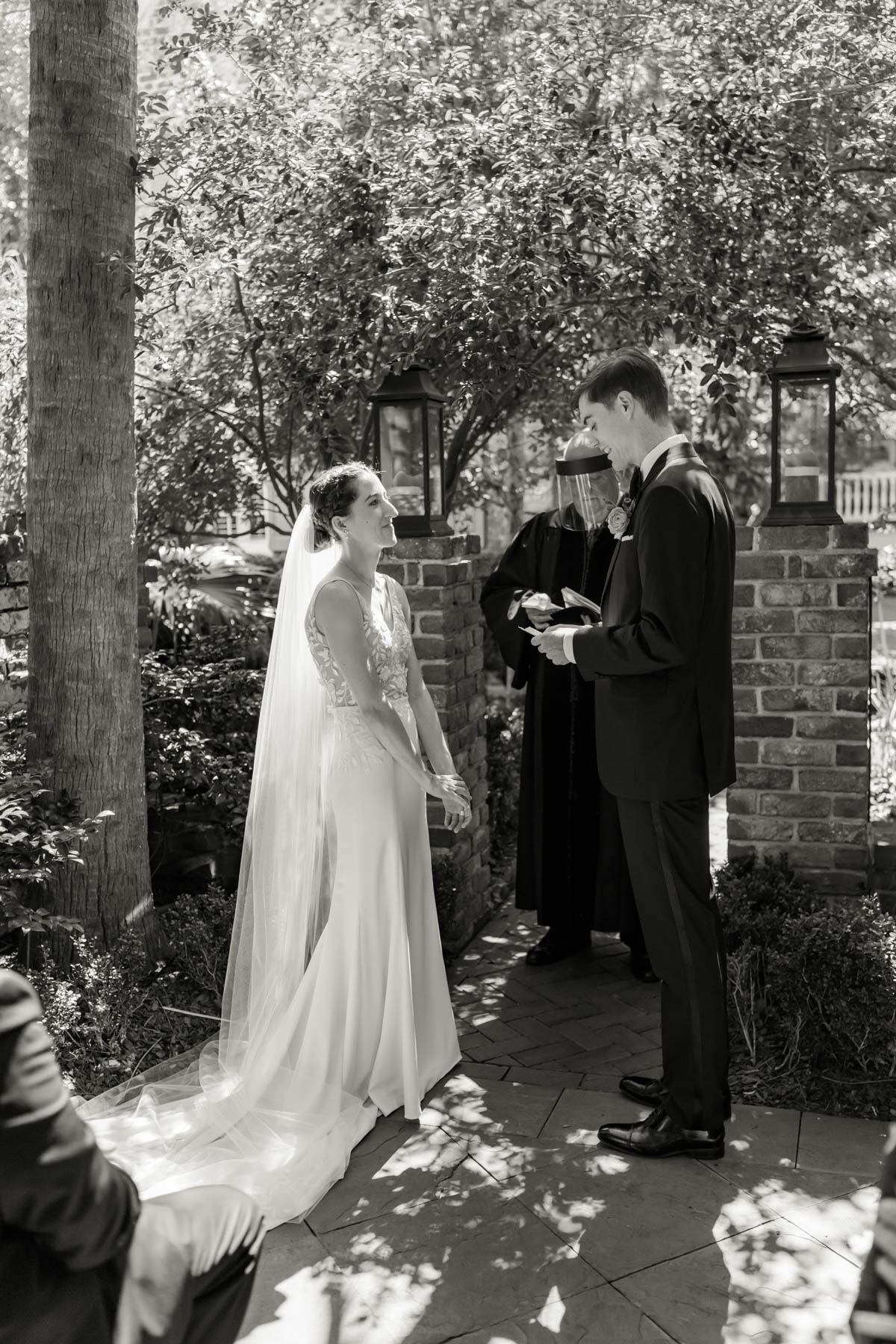 A groom reads his vows to his bride during their wedding ceremony