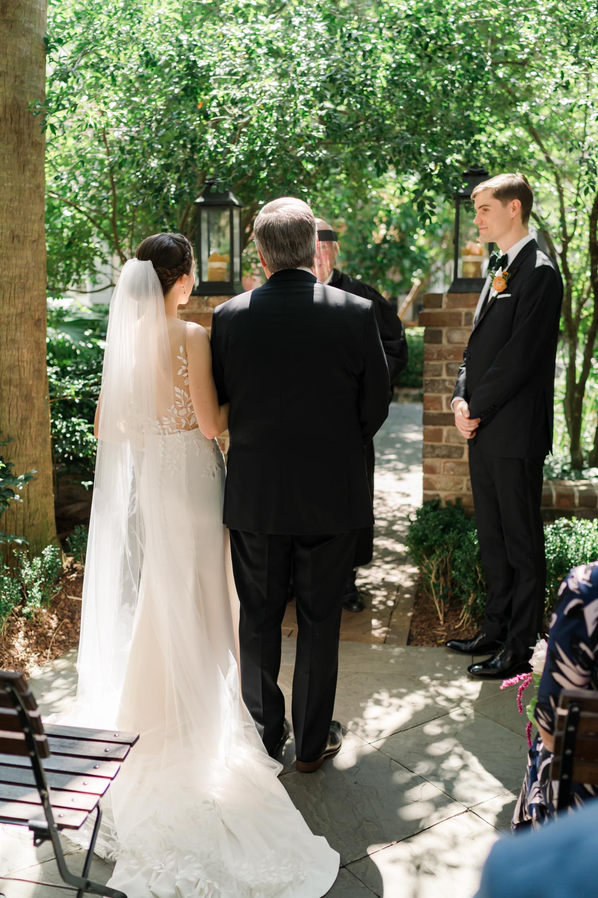 A bride and her father standing at the altar
