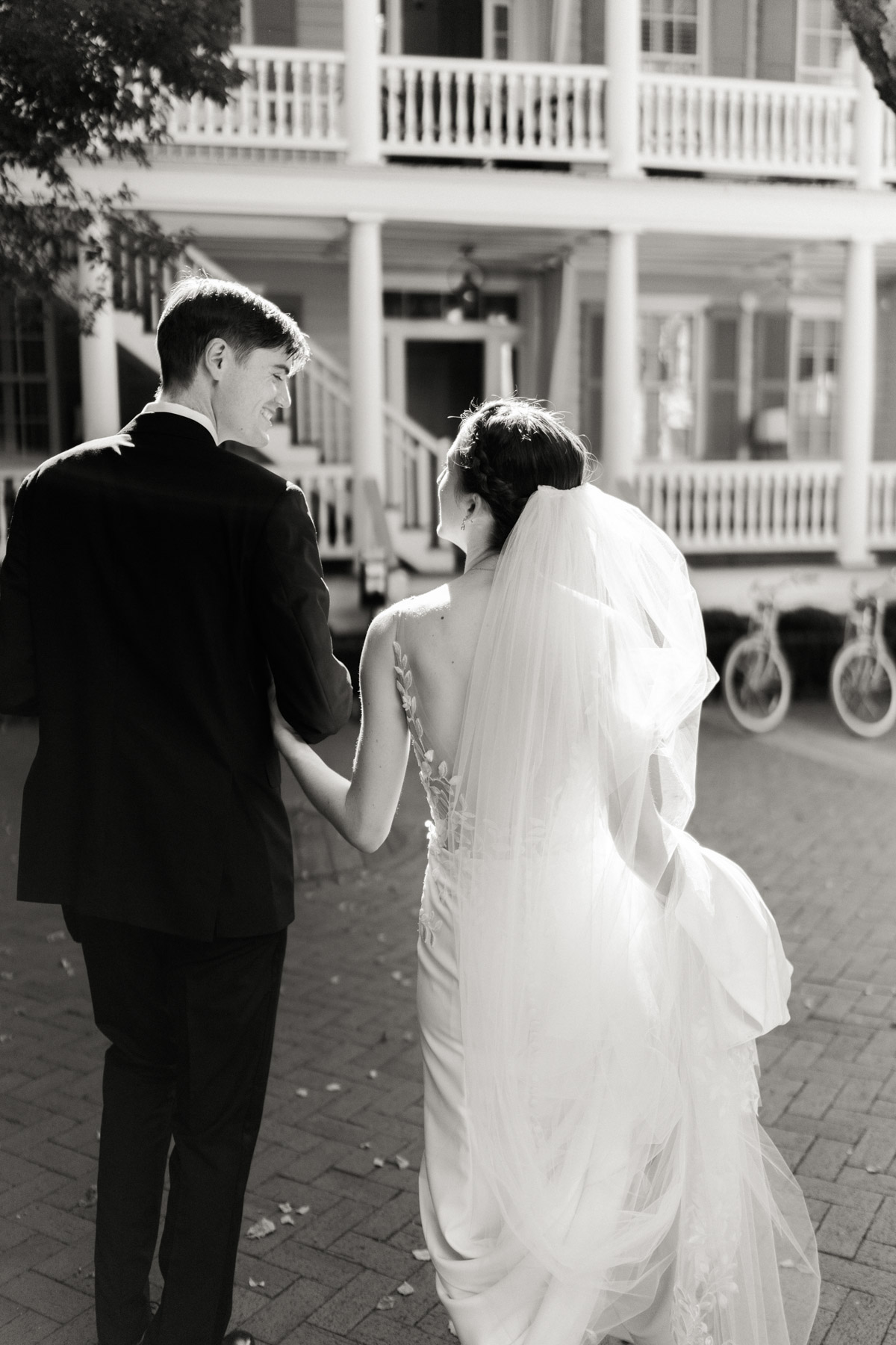 A bride and groom exit their intimate Charleston wedding reception at Zero George hotel