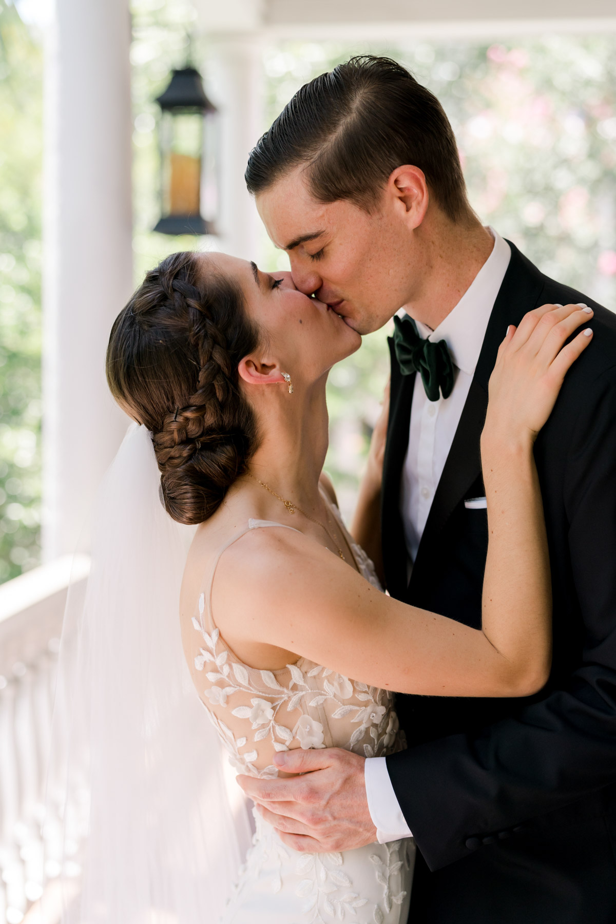 A bride and groom kiss 