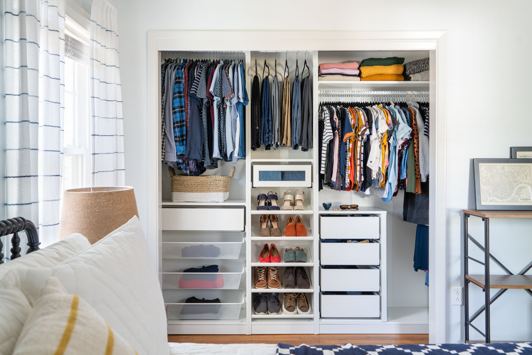 A master bedroom closet designed with IKEA PAX's wardrobe system