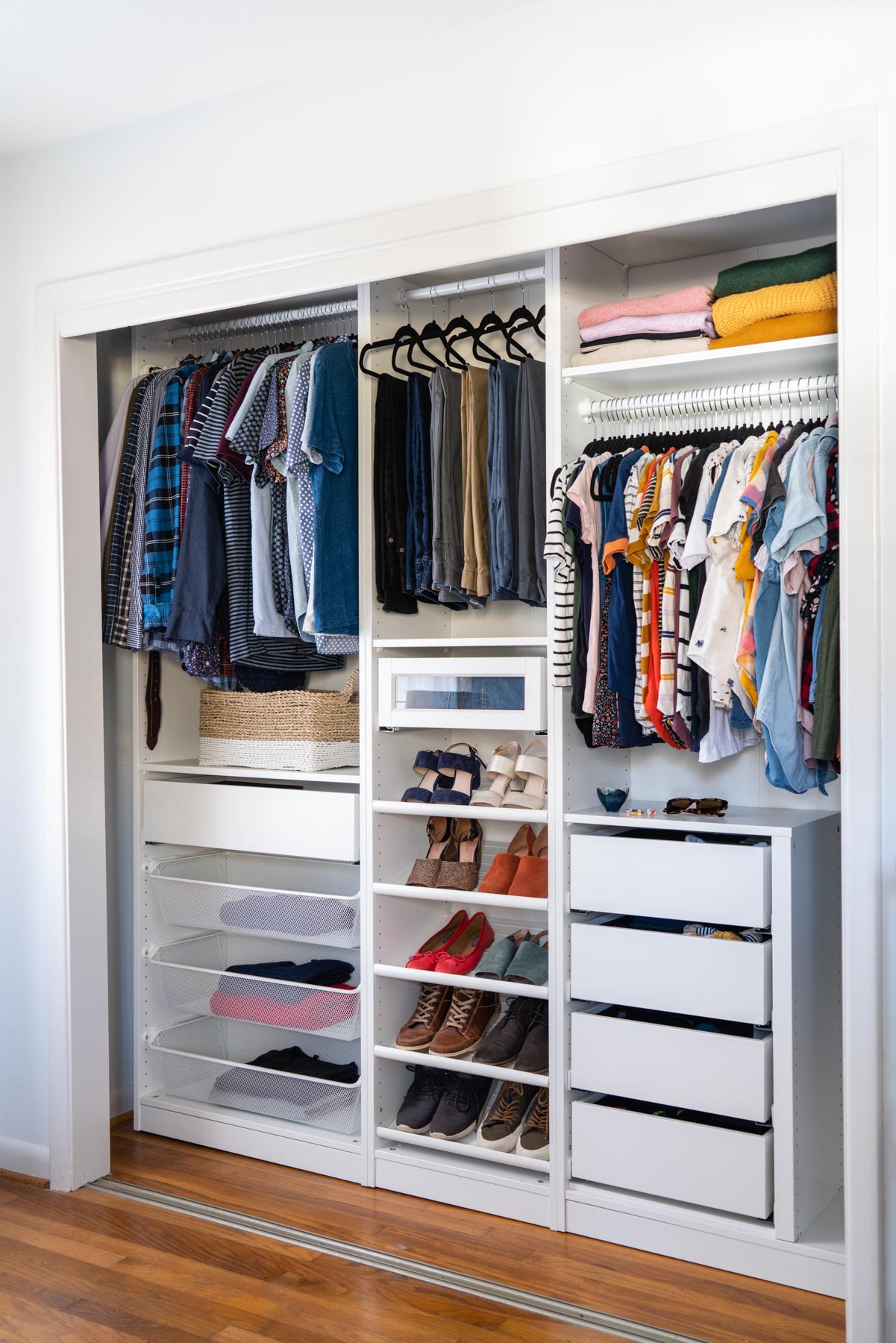 A master bedroom closet designed with IKEA PAX's wardrobe system